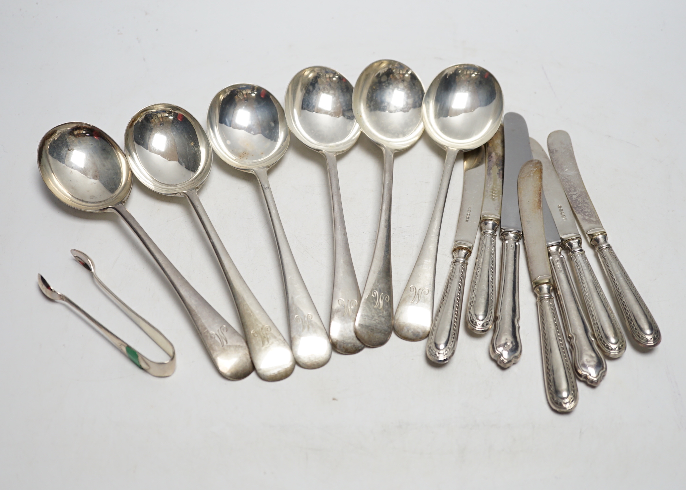 A set of six George V silver Old English pattern soup spoons, by James Dixon & Sons, a set of six silver handled tea knives and a pair of silver sugar tongs.